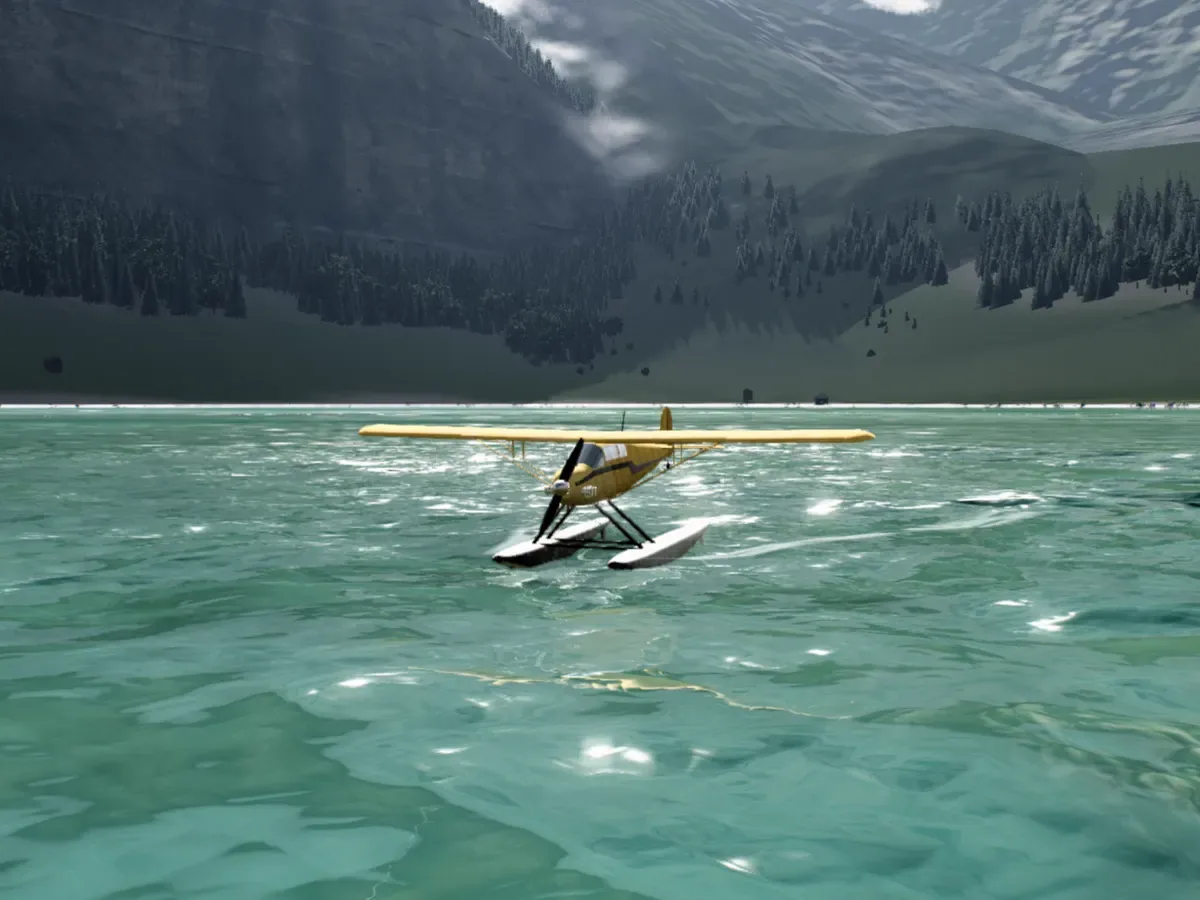 The yellow floatplane taxiing slowly on the lake, sunlight on the water, the valley behind.